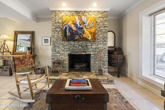 living room with ornamental molding, a stone fireplace, and light tile patterned flooring