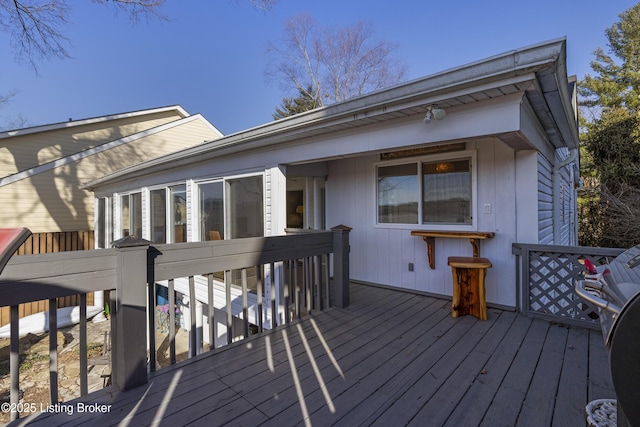 wooden deck featuring grilling area