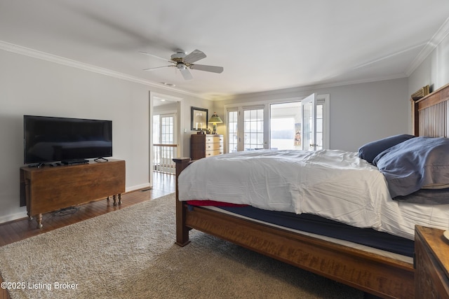 bedroom featuring crown molding, ceiling fan, dark wood-type flooring, and french doors