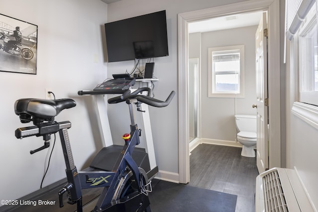 exercise room featuring dark hardwood / wood-style flooring