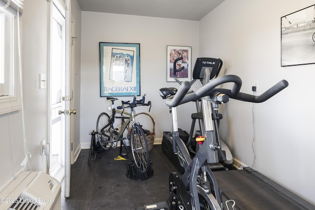 workout area featuring dark hardwood / wood-style flooring