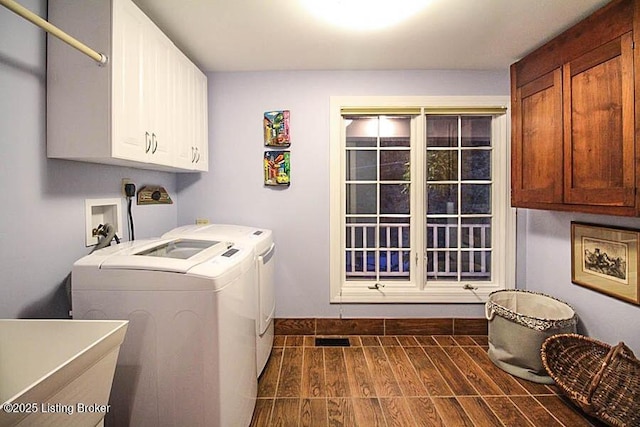 laundry room featuring independent washer and dryer, sink, and cabinets