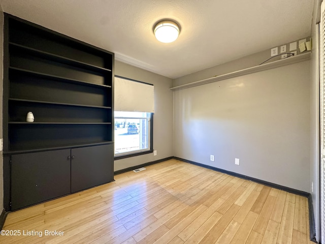 unfurnished bedroom with light hardwood / wood-style flooring