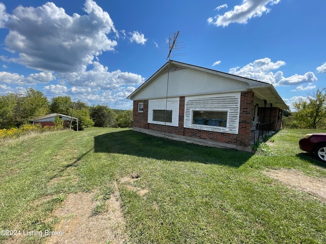 view of property exterior featuring a lawn