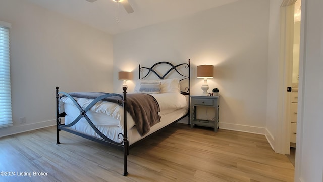 bedroom featuring ceiling fan and hardwood / wood-style flooring