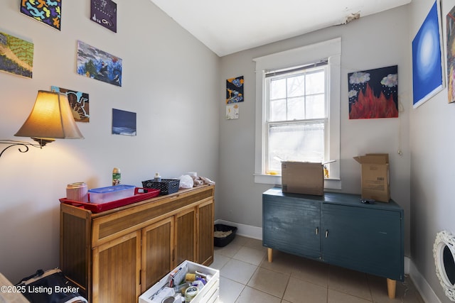 office area with light tile patterned floors and baseboards