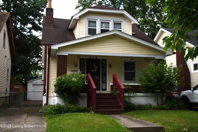 628 Harrison Ave, Louisville, KY 40217 - view of front of home with a porch, a chimney, an outdoor structure, a garage, and a shingled roof