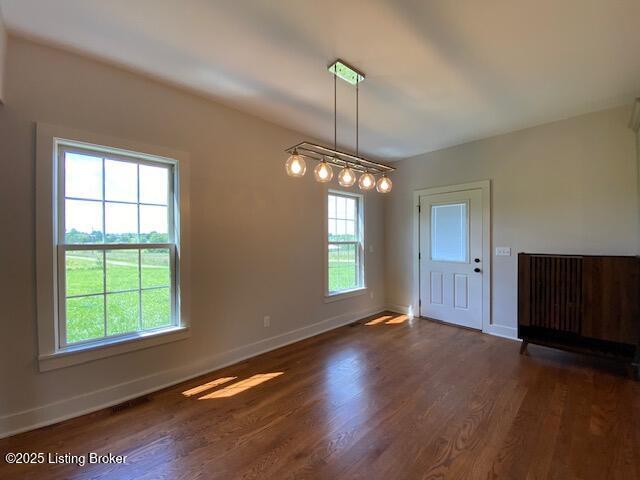 300 Sadie Ln, Bardstown, KY 40004 - unfurnished dining area featuring wood finished floors and baseboards