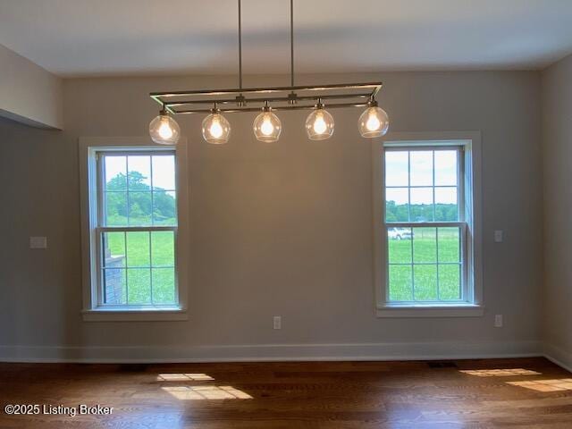 300 Sadie Ln, Bardstown, KY 40004 - unfurnished room featuring plenty of natural light, wood finished floors, and baseboards