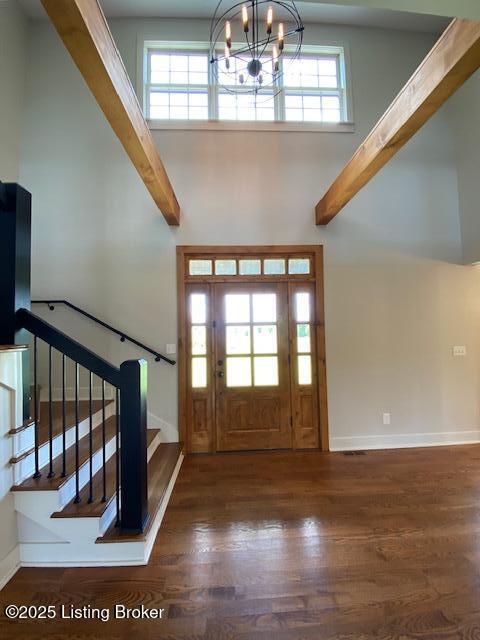 300 Sadie Ln, Bardstown, KY 40004 - foyer featuring wood finished floors, stairs, baseboards, a high ceiling, and a chandelier