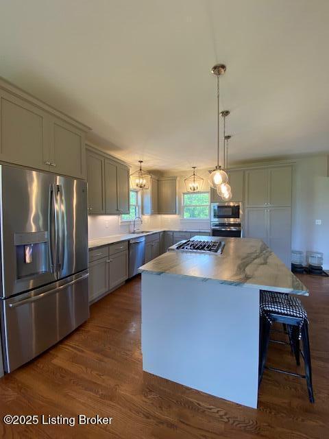 300 Sadie Ln, Bardstown, KY 40004 - kitchen featuring appliances with stainless steel finishes, gray cabinetry, a center island, and dark wood finished floors