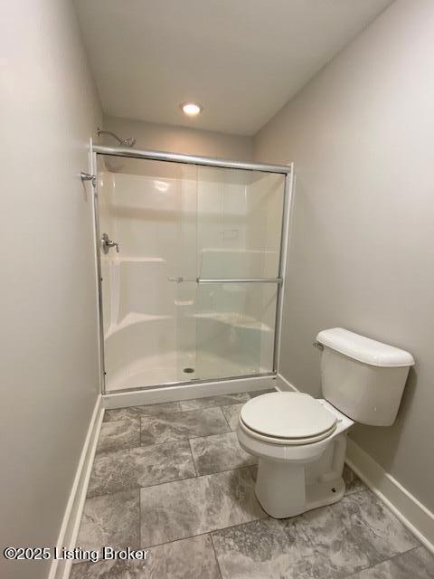 300 Sadie Ln, Bardstown, KY 40004 - bathroom featuring baseboards, toilet, a shower stall, and marble look tiles
