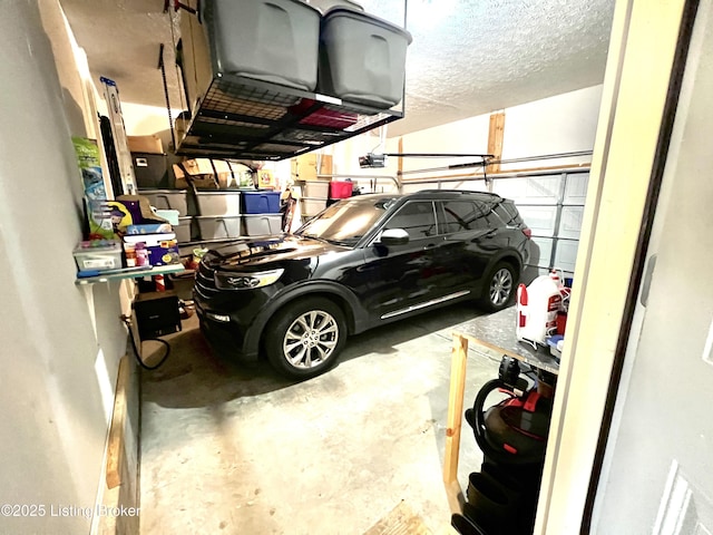 12023 Cascade Falls Trl, Louisville, KY 40229 - garage featuring a garage door opener