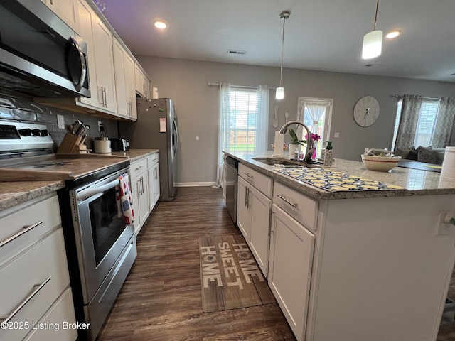 12023 Cascade Falls Trl, Louisville, KY 40229 - kitchen featuring stainless steel appliances, white cabinets, plenty of natural light, recessed lighting, and dark wood-style flooring