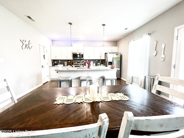 12023 Cascade Falls Trl, Louisville, KY 40229 - dining room featuring baseboards and dark wood-type flooring