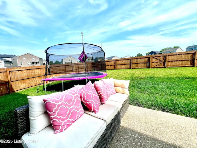 12023 Cascade Falls Trl, Louisville, KY 40229 - fenced backyard featuring a trampoline and a residential view