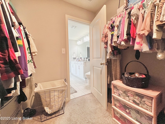 12023 Cascade Falls Trl, Louisville, KY 40229 - walk in closet with light colored carpet and light tile patterned floors