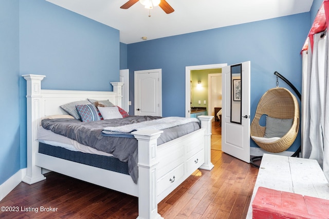 bedroom with ceiling fan and hardwood / wood-style flooring