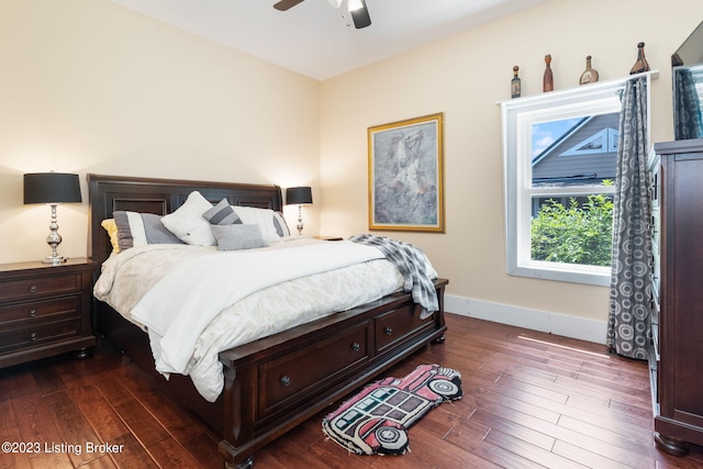 bedroom with ceiling fan and dark hardwood / wood-style flooring