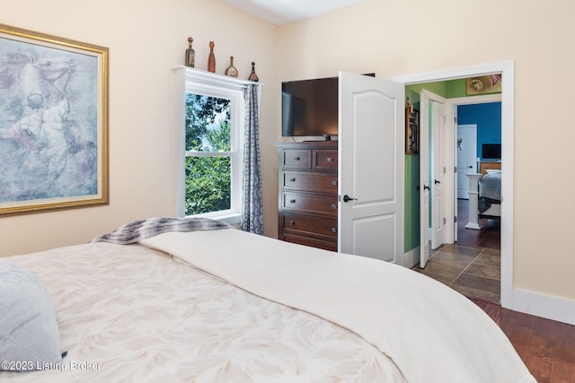 bedroom featuring dark hardwood / wood-style floors