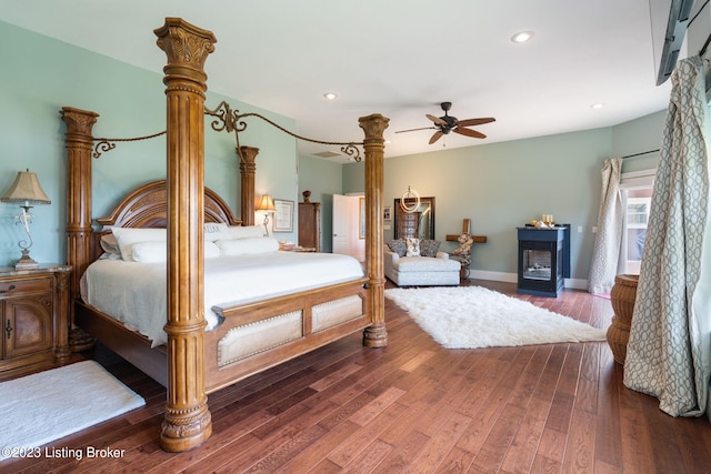 bedroom featuring ceiling fan and dark hardwood / wood-style floors