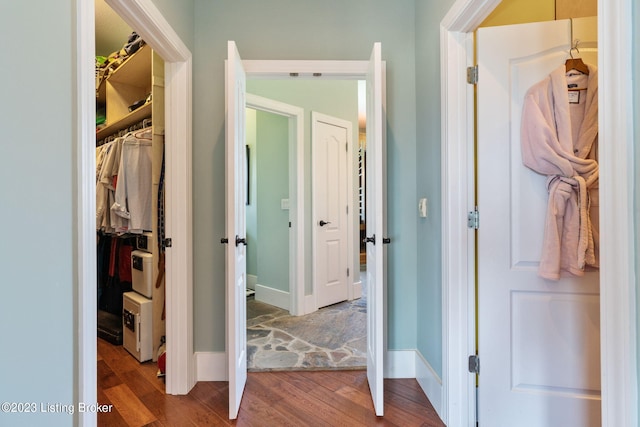 hallway featuring dark hardwood / wood-style floors