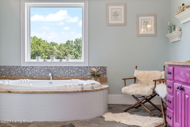 bathroom with a washtub and plenty of natural light