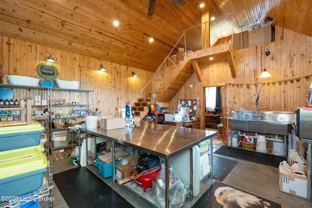 interior space with wooden walls, high vaulted ceiling, and wooden ceiling