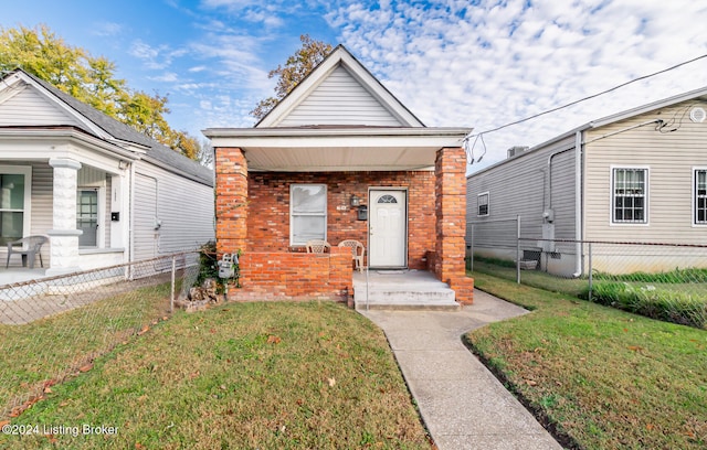 bungalow-style house with a front yard