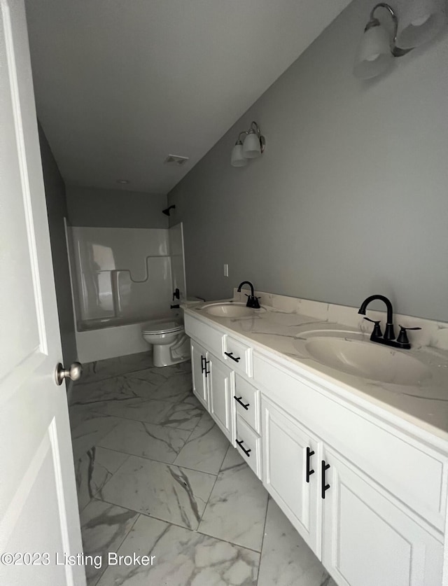 full bathroom with bathing tub / shower combination, toilet, tile floors, and dual bowl vanity