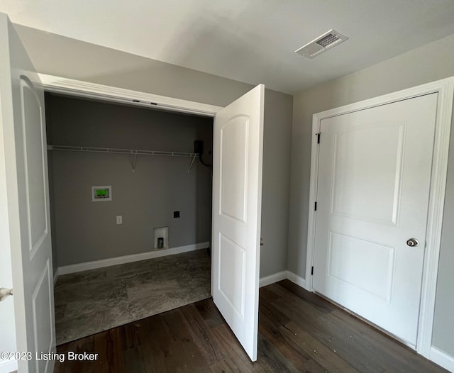 laundry room with washer hookup and dark hardwood / wood-style flooring