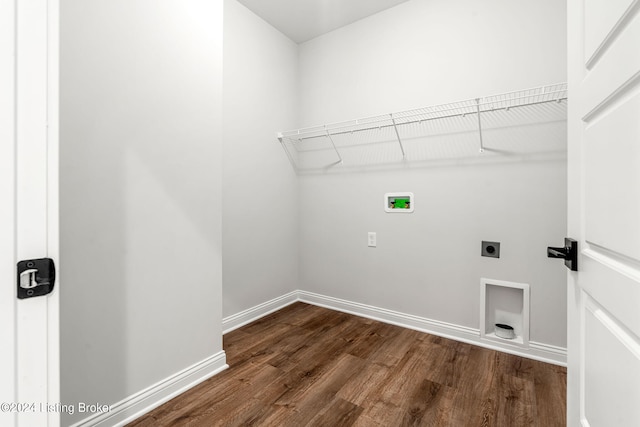 laundry room featuring washer hookup, dark wood finished floors, electric dryer hookup, laundry area, and baseboards