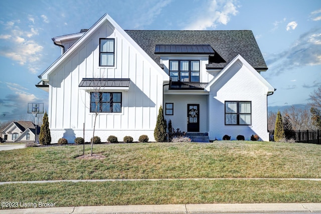 modern farmhouse with a front lawn