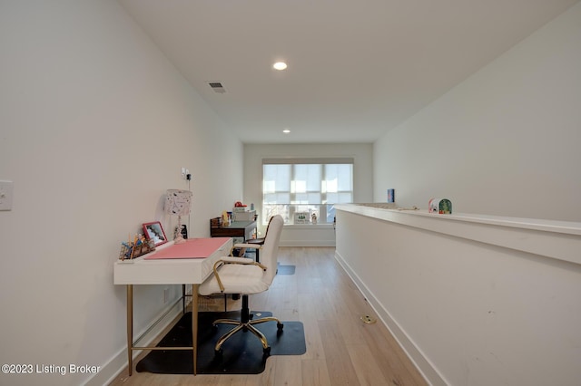 office space with light wood-type flooring