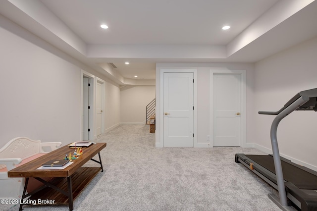 exercise area with light colored carpet