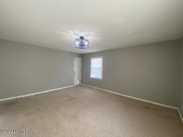 empty room featuring carpet flooring