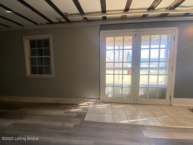 doorway to outside with wood-type flooring and french doors