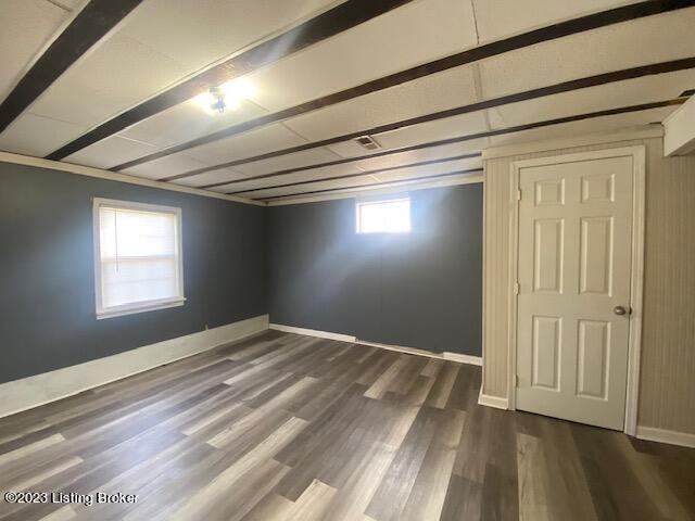 basement featuring dark hardwood / wood-style flooring