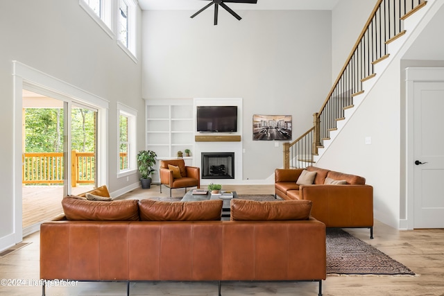 4203 Ballard Ridge Ct Lot 3, Smithfield, KY 40068 - living area with a towering ceiling, light wood-type flooring, a fireplace, a ceiling fan, and stairway