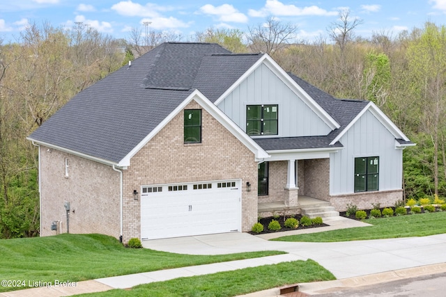 view of front of house with a garage and a front yard