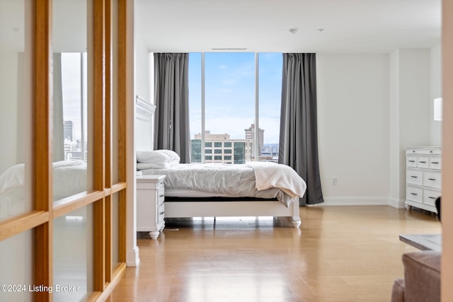 bedroom with light hardwood / wood-style floors