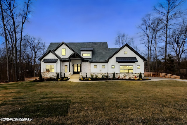 modern inspired farmhouse featuring a front lawn