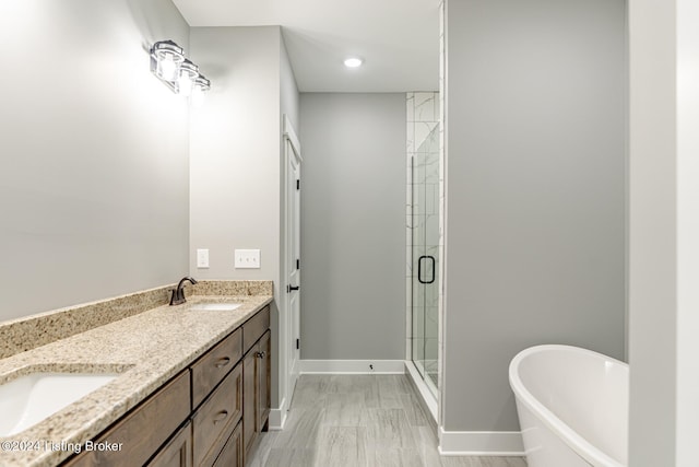 bathroom featuring vanity and plus walk in shower