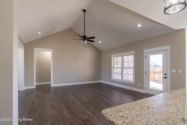 unfurnished living room featuring ceiling fan, dark hardwood / wood-style flooring, and vaulted ceiling