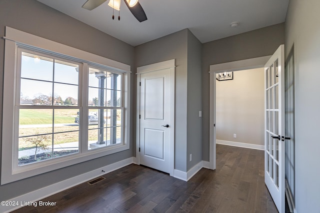 interior space featuring ceiling fan, french doors, and dark hardwood / wood-style floors