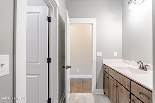 bathroom with wood-type flooring and vanity