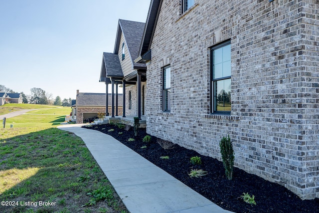 view of home's exterior featuring a yard