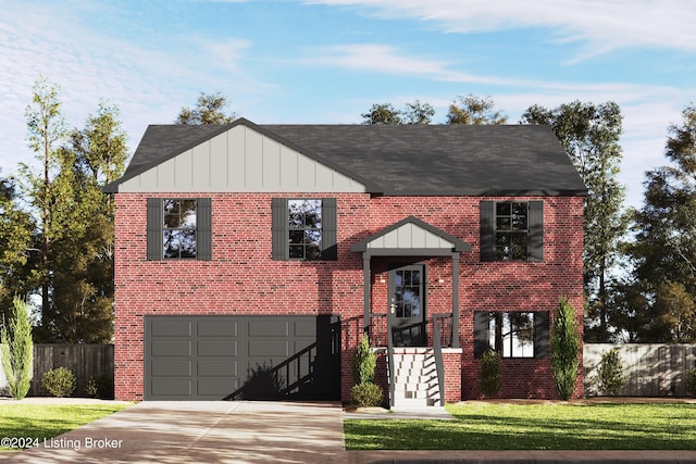 view of front of house with a front yard and a garage