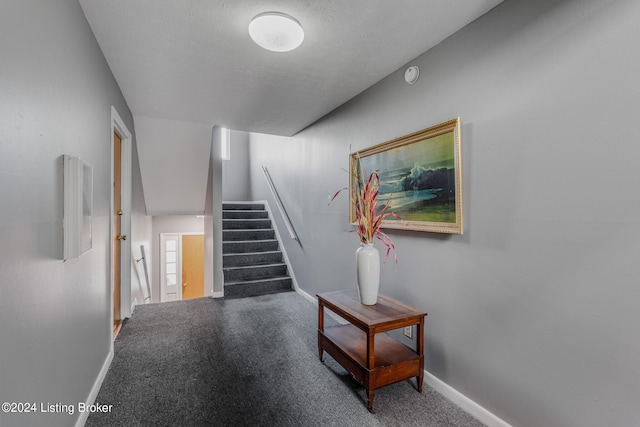 corridor featuring a textured ceiling