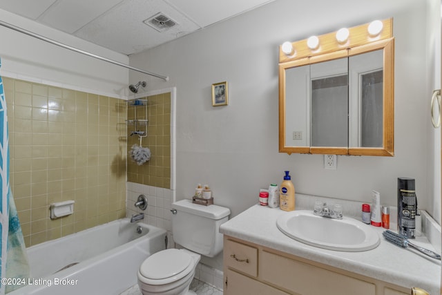 full bathroom featuring oversized vanity, toilet, tile floors, and shower / bathtub combination with curtain